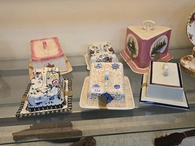 Lot 320 - An assortment of six lidded cheese dishes to...
