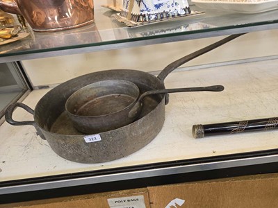 Lot 323 - A copper cooking pan along with an oversized...