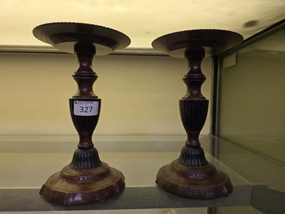 Lot 327 - A pair of marble effect metalwork candlesticks...