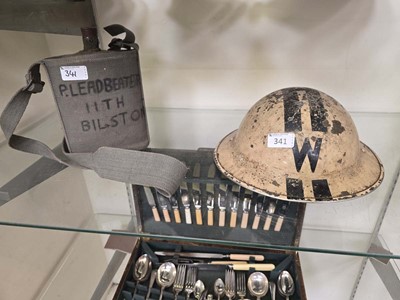 Lot 341 - A 20th century metalwork helmet along with a...