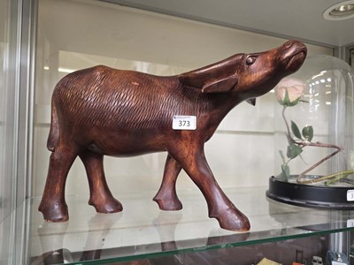 Lot 373 - A carved wooden model of an African water buffalo