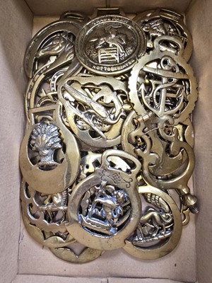 Lot 392 - A carton containing a quantity of horse brasses