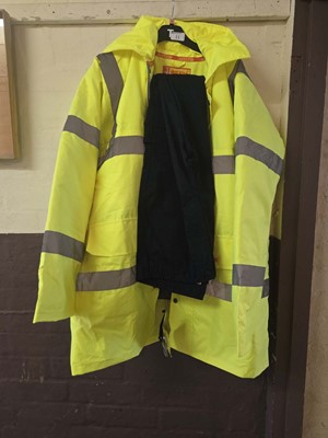 Lot 11 - A yellow hi-vis coat together with a pair of...