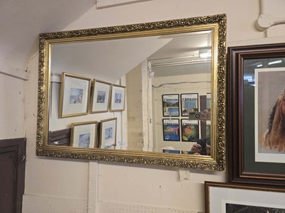 Lot 14 - An ornate gilt framed rectangular bevel glass...