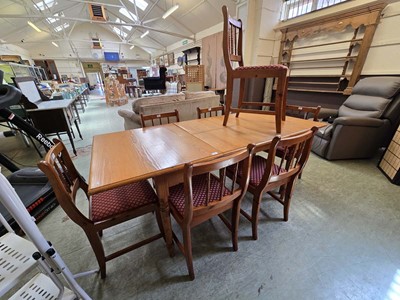 Lot 16 - A modern pine extending dining table together...