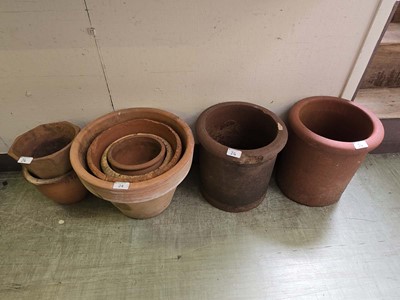 Lot 24 - A collection of eight terracotta garden pots