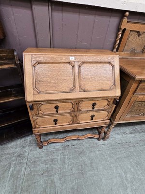 Lot 42 - An early 20th century oak fall front bureau...