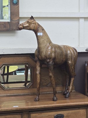 Lot 46 - A large Liberties style leather sculpture of a...