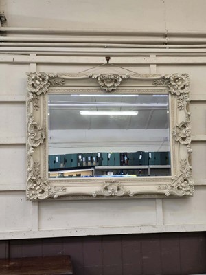 Lot 53 - A cream painted ornate framed wall mirror