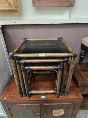 Lot 58 - A nest of three bamboo nest of tables with...