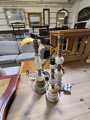 Lot 104 - Three onyx and metal work table lamps together...