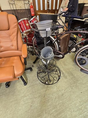 Lot 112 - A three tier black metalwork garden planter,...