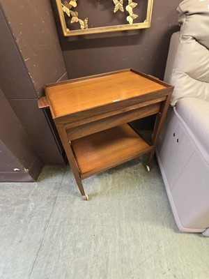 Lot 120 - A mid 20th teak two tier tea trolley with...