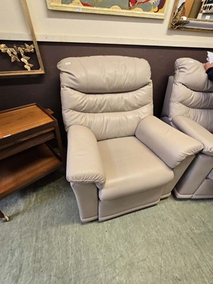 Lot 123 - A mushroom leather reclining chair of high...