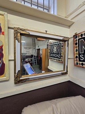 Lot 125 - A gilt and grey painted wall mirror