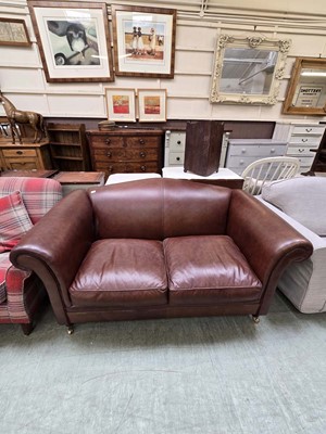 Lot 89 - A modern brown leather two seater sofa