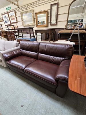 Lot 91 - A modern brown leather three seater sofa