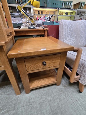 Lot 99 - A modern oak side table with single drawer...