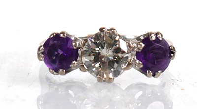 Lot 737 - An 18ct white gold ring set diamond and two...