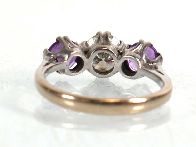 Lot 737 - An 18ct white gold ring set diamond and two...