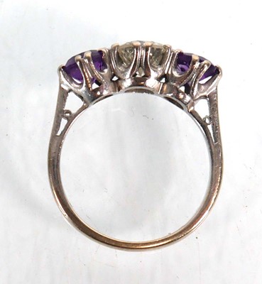 Lot 737 - An 18ct white gold ring set diamond and two...