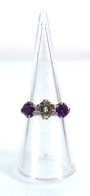 Lot 737 - An 18ct white gold ring set diamond and two...