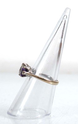 Lot 737 - An 18ct white gold ring set diamond and two...