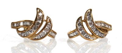 Lot 738 - A pair of 9ct white gold ear studs, each set...