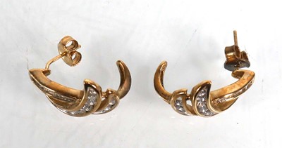 Lot 738 - A pair of 9ct white gold ear studs, each set...