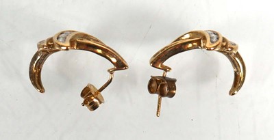 Lot 738 - A pair of 9ct white gold ear studs, each set...