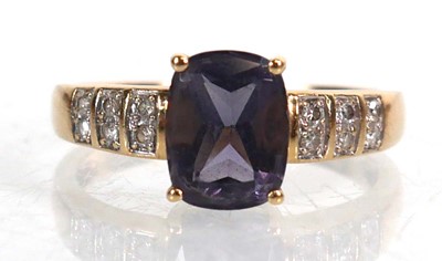 Lot 735 - A 9ct yellow gold ring set cushion cut...