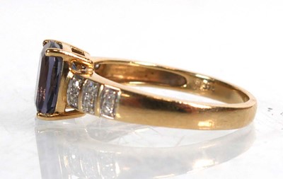 Lot 735 - A 9ct yellow gold ring set cushion cut...