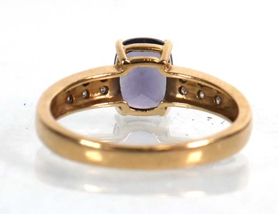 Lot 735 - A 9ct yellow gold ring set cushion cut...