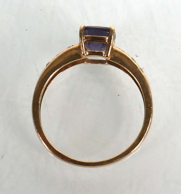 Lot 735 - A 9ct yellow gold ring set cushion cut...