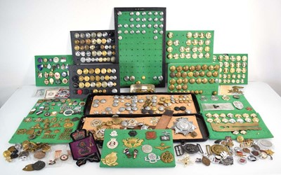 Lot 108 - A collection of buttons, badges, belt buckles,...