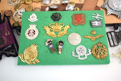 Lot 108 - A collection of buttons, badges, belt buckles,...