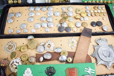 Lot 108 - A collection of buttons, badges, belt buckles,...