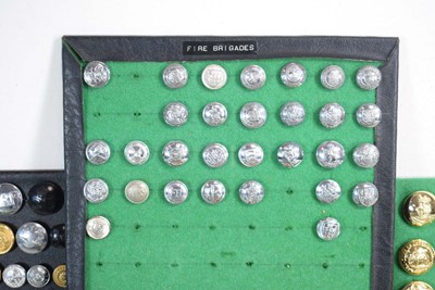 Lot 108 - A collection of buttons, badges, belt buckles,...
