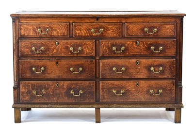 Lot 1 - An 18th century oak mule chest, the lift lid...