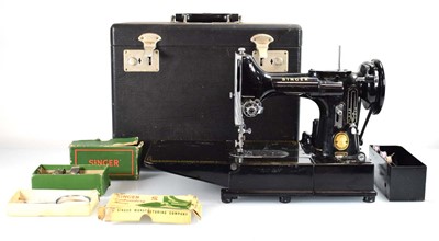 Lot 81 - A cased Singer 222K sewing machine