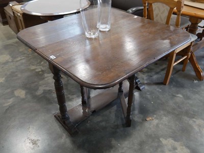 Lot 1226 - Dark oak drop side dining table