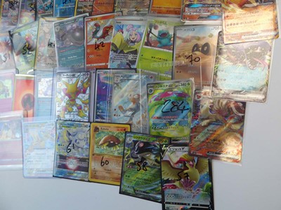 Lot Qty of top loaded/sleeved Pokémon cards from...
