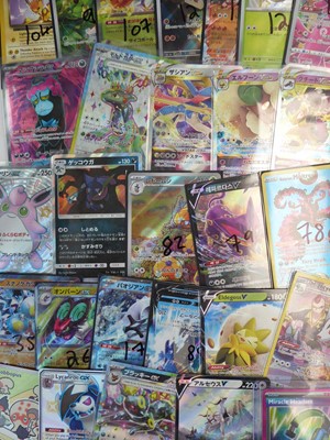 Lot Qty of top loaded/sleeved Pokémon cards from...