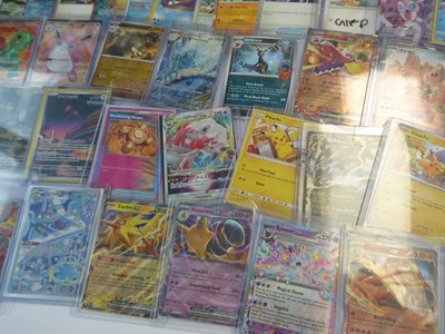 Lot Qty of top loaded/sleeved Pokémon cards from...