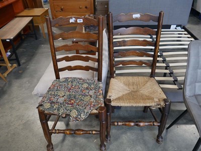 Lot 1266 - Pair of dark oak ladder back rush seated...