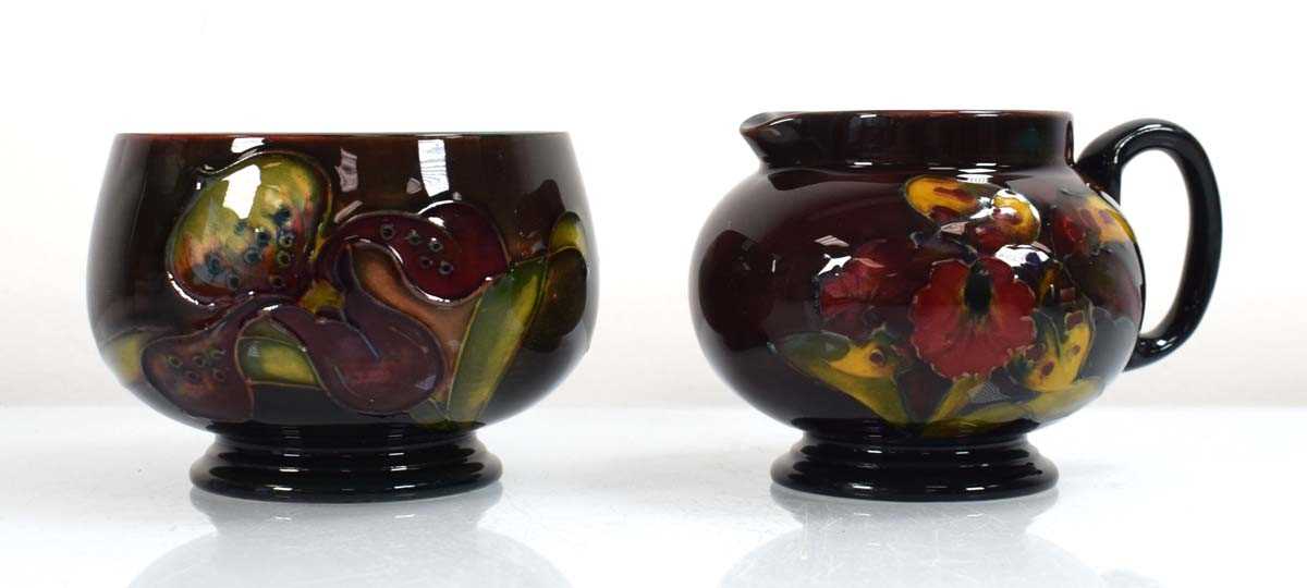 Lot 249 - A Moorcroft flambe cream jug decorated in the...