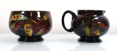 Lot 249 - A Moorcroft flambe cream jug decorated in the...