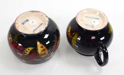 Lot 249 - A Moorcroft flambe cream jug decorated in the...