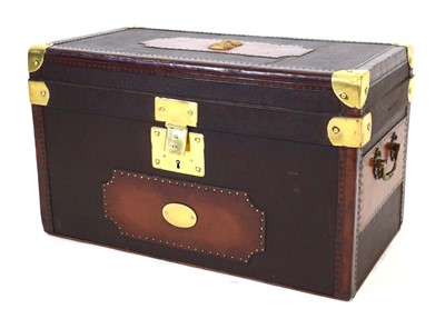 Lot 10 - A canvas travel trunk with leather and brass...