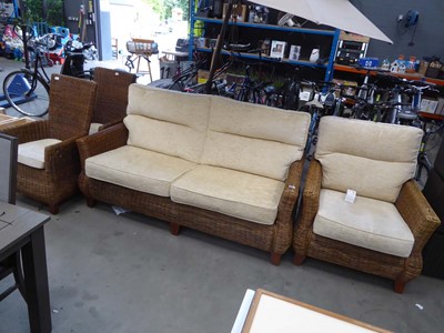 Lot 4049 - Rattan lounge suite with loose beige cushions,...
